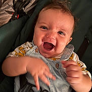 Timélyo participe au concours pour gagner de l'argent avec cette photo : baby, child, smiling, happy, face, hands, overalls, clothing, stroller, seatbelt, infant, cute, joyful, motion_blur, portrait, indoor, person, expression, young_child, closeup