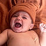 Timélyo a rejoint le concours — aidez-le/la à gagner de superbes lots ! baby, infant, smiling, laughing, hat, brown_hat, blanket, soft_texture, cozy, cute, happy, skin, lying_down, child, indoors, portrait, expression, cheerful, closeup, face