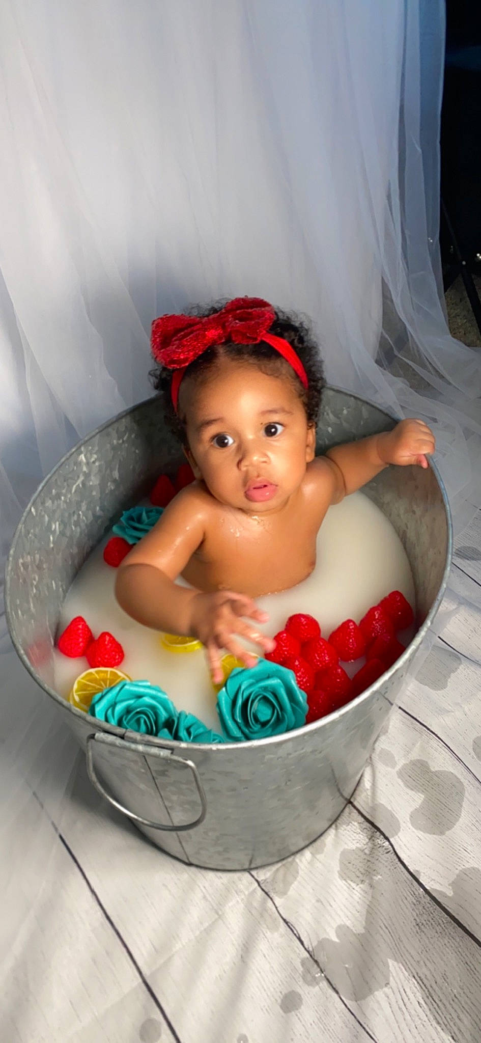 Dakota is registered to the contest to win money with this photo: baby, baby_products, bathing, bathroom, bathtub, cheek, chest, child, eye, eyelash, fun, hand, person, personal_care, pink, plumbing_fixture, product, sitting, skin, toddler