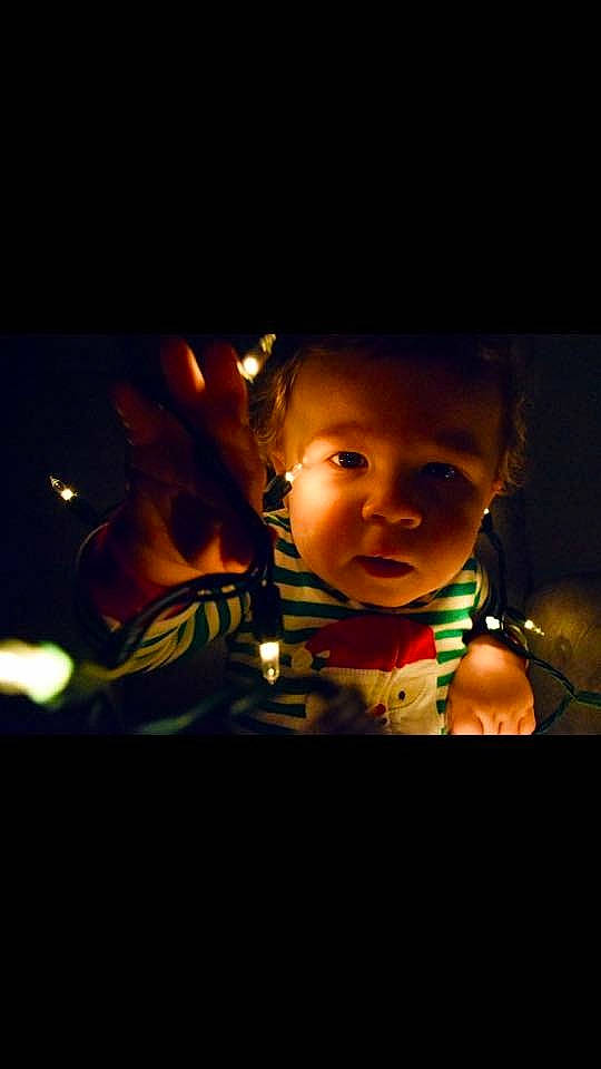 Dominic is registered to the contest to win money with this photo: cheek, child, darkness, face, flash_photography, fun, head, light, lighting, night, nose, person, photography, portrait, sky, smile, space, toddler