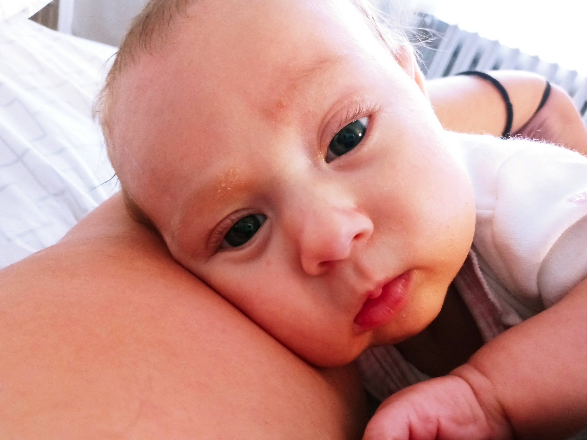 Stevie is registered to the contest to win money with this photo: arm, baby, cheek, chin, ear, eye, eyelash, facial_expression, finger, gesture, hand, happy, iris, lip, mammal, mouth, nose, person, skin, thumb