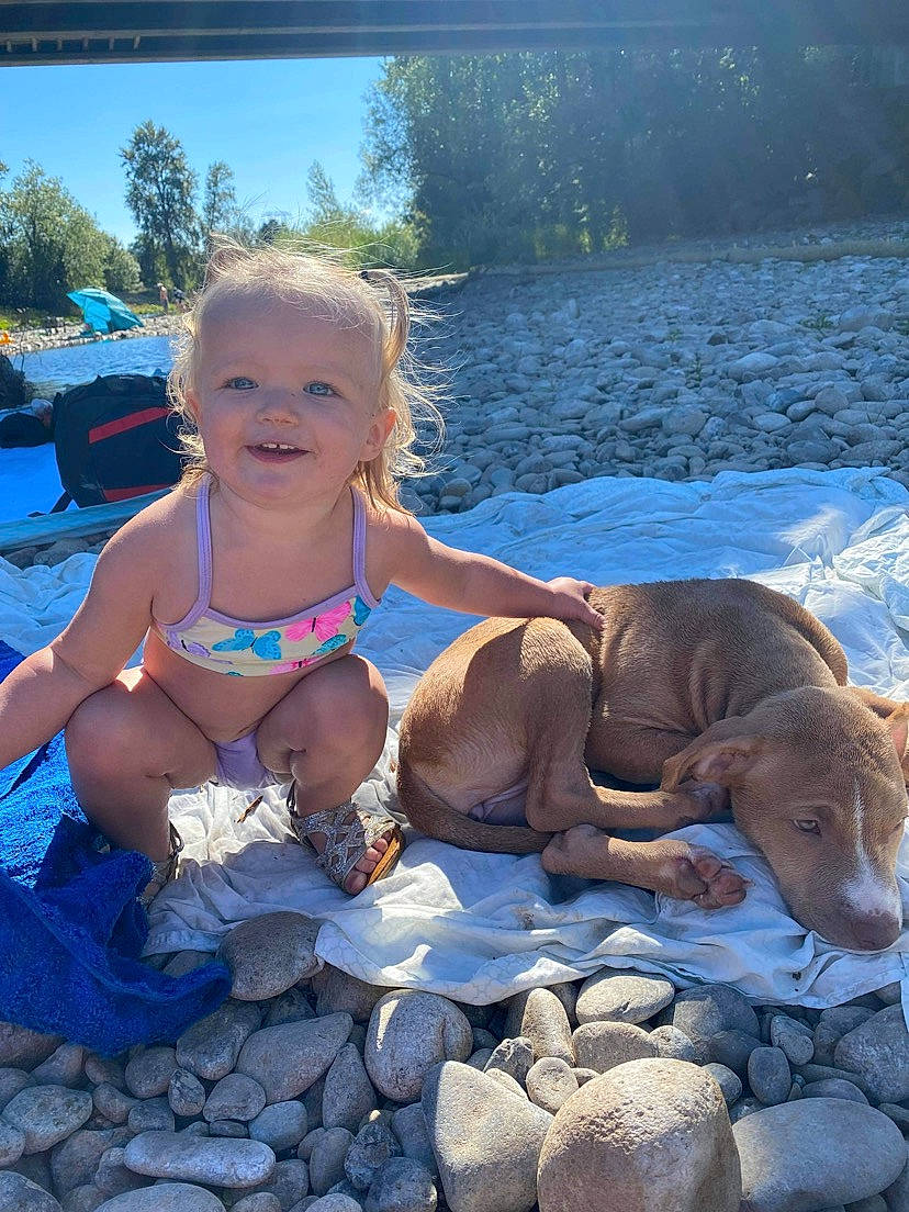 Samantha is registered to the contest to win money with this photo: blue, body_of_water, brassiere, child, event, fun, happy, lake, leisure, morning, person, recreation, sitting, sky, smile, summer, sun_tanning, swimwear, toddler, underpants