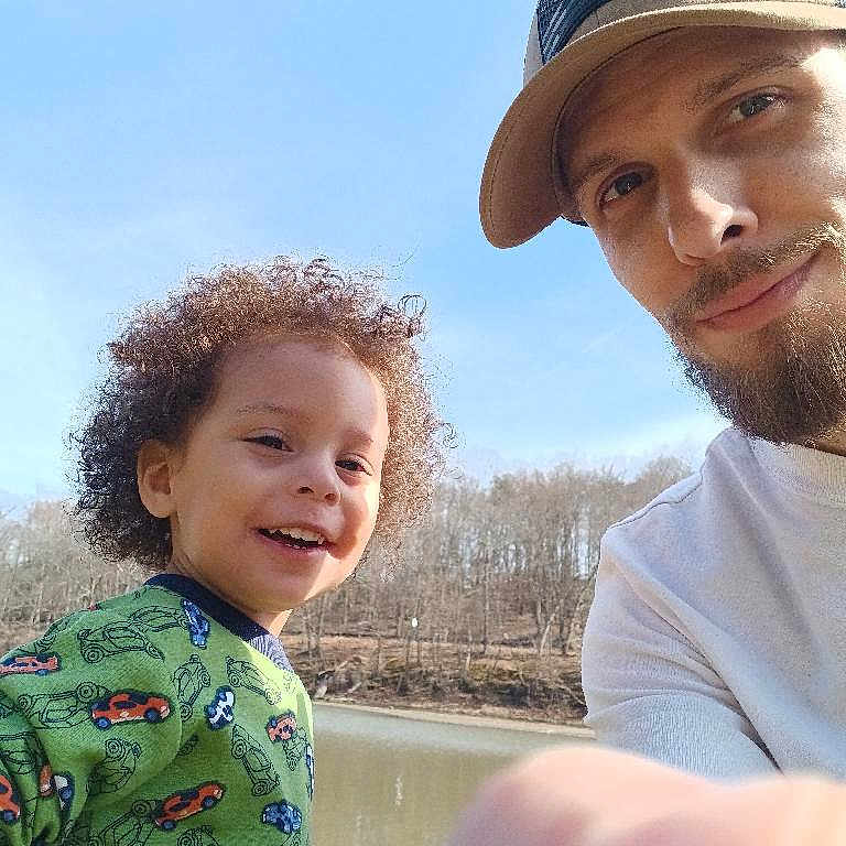 Jaydence joined the competition — help win amazing prizes! adult, baby, baseballcap, cap, clothing, face, happy, hat, head, lake, male, man, nature, outdoors, person, photography, portrait, smile, t_shirt, water