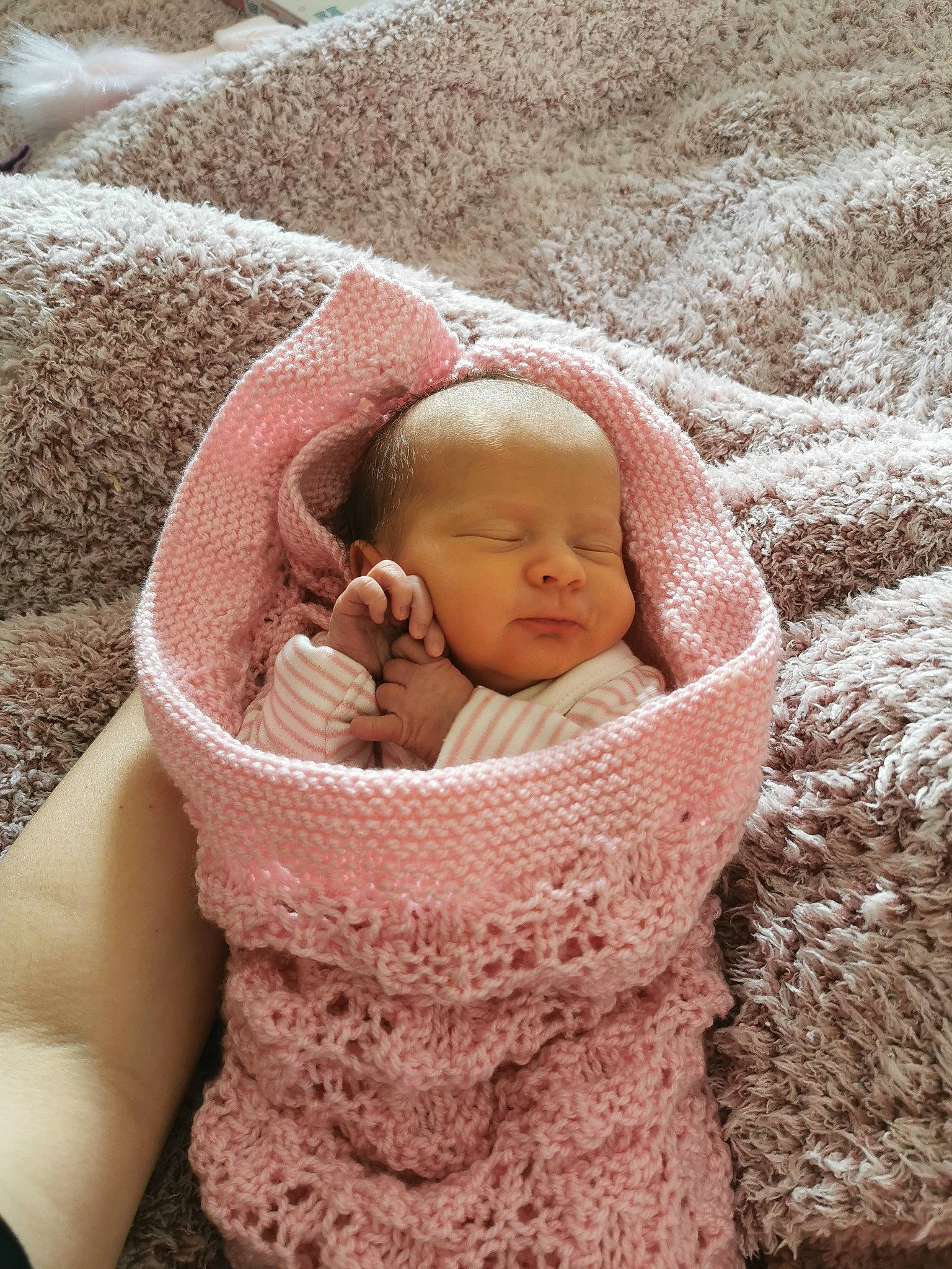 Eve joined the competition — help win amazing prizes! baby, baby_products, baby_safety, baby_sleeping, baby_toddler_clothing, bonnet, cheek, comfort, fashion_accessory, fur, grass, headgear, linens, person, pink, sand, sitting, textile, toddler, wool