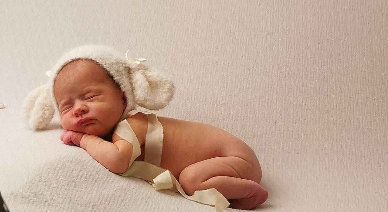 Eve joined the competition — help win amazing prizes! arm, baby, baby_sleeping, baby_toddler_clothing, barefoot, child, comfort, fashion_accessory, foot, human_body, human_leg, iris, knee, linens, person, portrait_photography, sitting, thigh, thumb, toddler