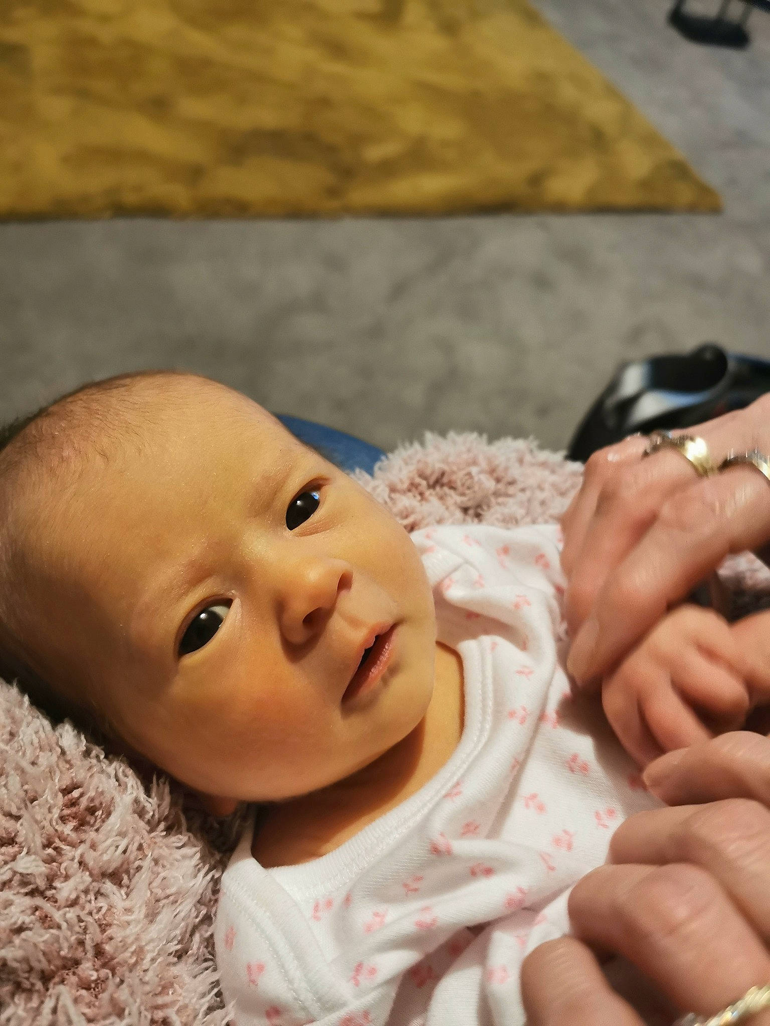 Eve joined the competition — help win amazing prizes! baby, baby_toddler_clothing, cheek, child, comfort, eye, eyebrow, finger, flooring, gesture, happy, iris, mobile_phone, nail, nose, person, sitting, skin, thumb, toddler