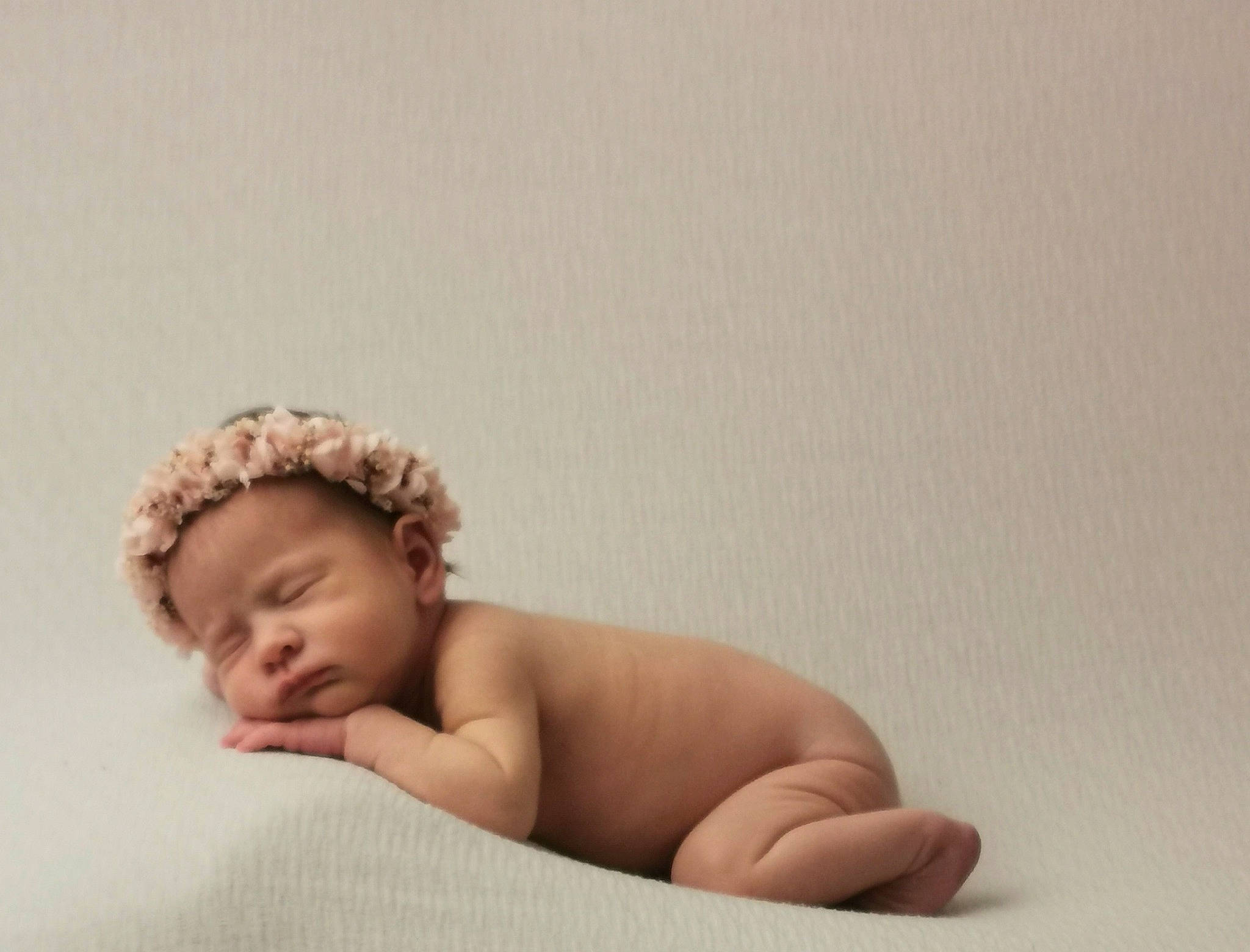 Eve is registered to the contest to win money with this photo: arm, baby, baby_sleeping, baby_toddler_clothing, bedding, comfort, ear, eyebrow, fashion_accessory, finger, flash_photography, happy, headband, headgear, headpiece, human_leg, linens, neck, person, stomach