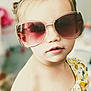 casual, child, closeup, cute, expression, eyewear, face, fashion, hair, indoor, light, person, portrait, skin, soft_focus, summer, sunglasses, toddler, yellow_dress, young_child