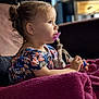 Joyce a rejoint le concours — aidez-le/la à gagner de superbes lots ! blanket, child, colorful_clothing, couch, cozy, curly_hair, cute, earrings, focus, home, indoor, pacifier, portrait, side_view, sitting, soft_light, thoughtful, toddler, toy, young_child