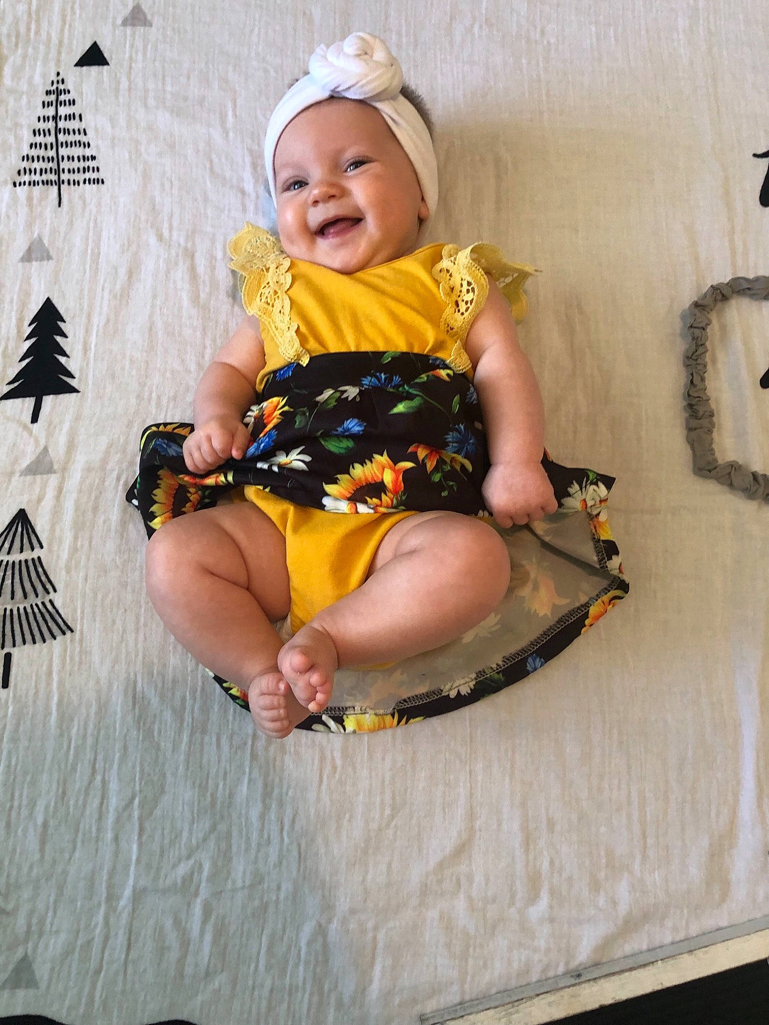 Elyse joined the competition — help win amazing prizes! baby, baby_products, baby_toddler_clothing, child, comfort, costume_hat, fun, happy, hat, headwear, lap, leisure, pattern, person, pink, play, shorts, sitting, smile, t_shirt