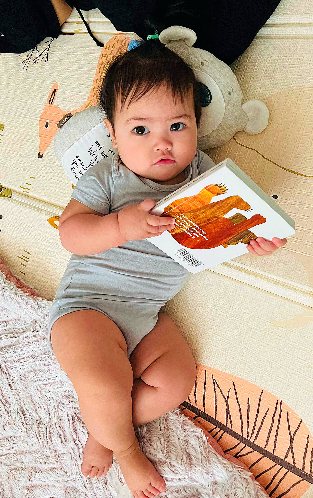 Mariella is registered to the contest to win money with this photo: abdomen, baby_toddler_clothing, barefoot, cheek, child, comfort, elbow, eye, facial_expression, foot, happy, human_leg, knee, lap, leg, person, shorts, skin, thigh, toddler