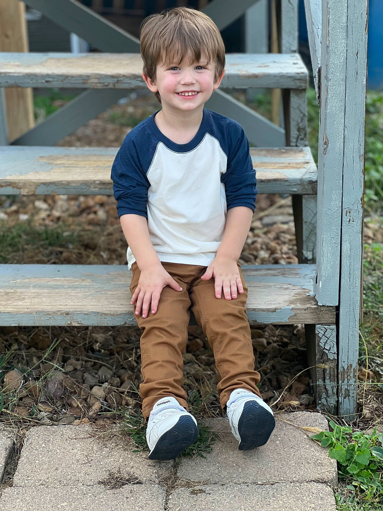 Jordan is registered to the contest to win money with this photo: baby_toddler_clothing, child, eye, face, footwear, grass, hair, happy, human_body, joy, knee, leaf, leisure, people_in_nature, person, plant, sleeve, smile, t_shirt, thigh