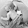 baby, sleeping, blanket, cushion, plush_toy, star, knitted, soft, peaceful, infant, resting, indoors, portrait, child, cozy, bare_skin, carpet, cute, head, relaxing