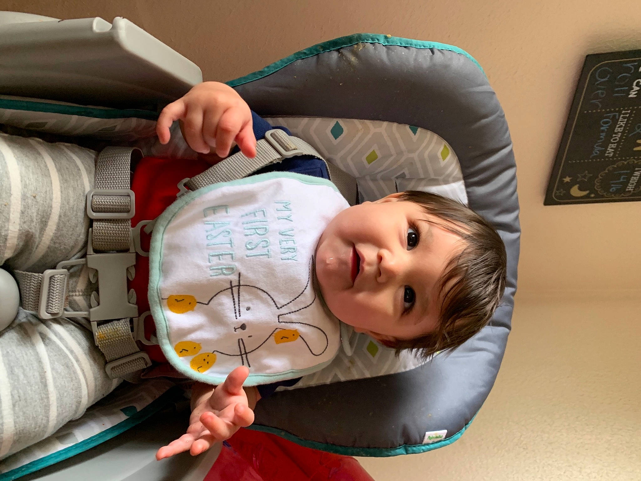 Felix is registered to the contest to win money with this photo: abdomen, arm, baby, baby_products, baby_toddler_clothing, child, comfort, elbow, flash_photography, fun, happy, headgear, mouth, person, picture_frame, room, sitting, sleeve, smile, toddler