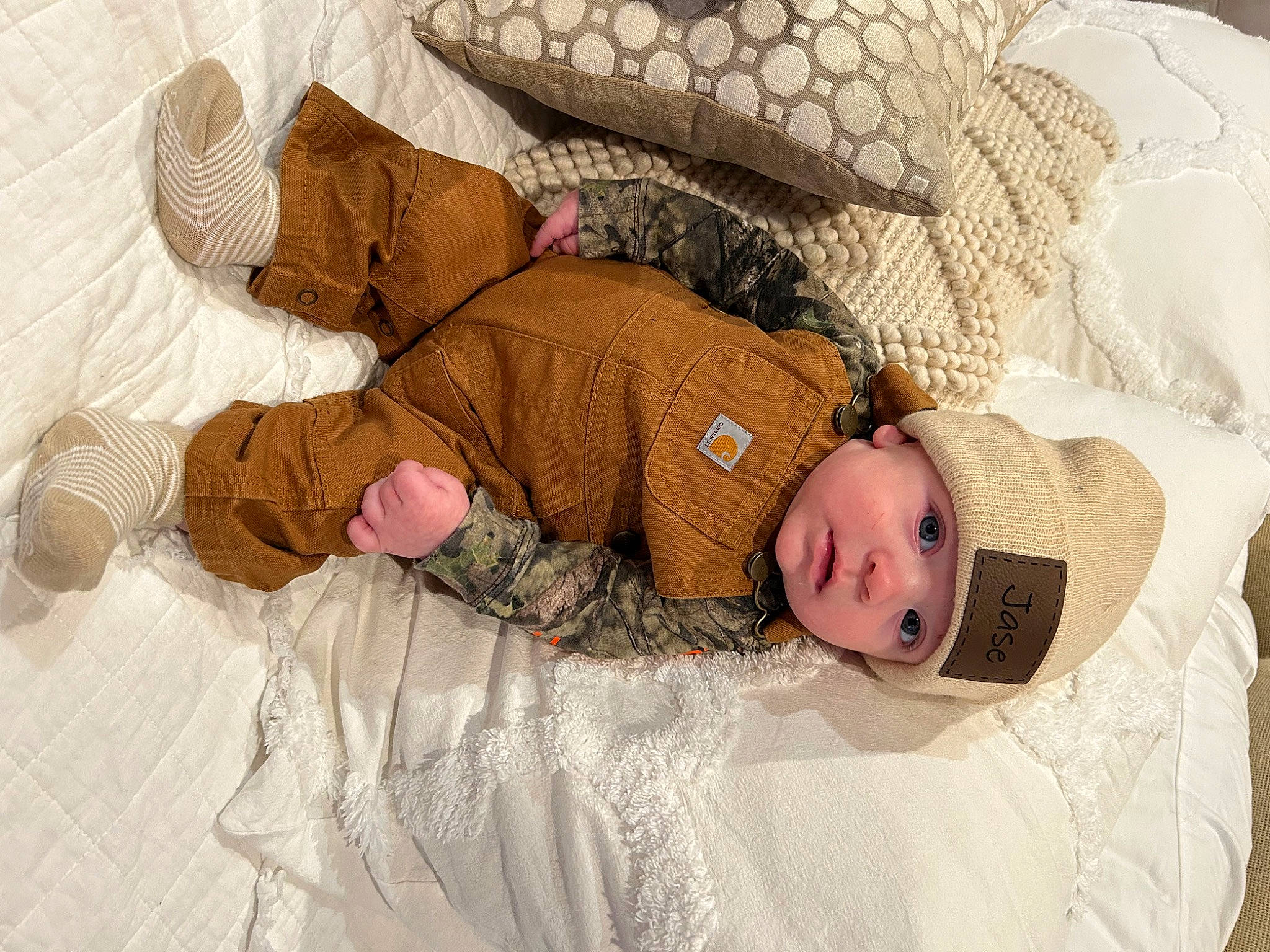 Jase is registered to the contest to win money with this photo: arm, baby, baby_sleeping, baby_toddler_clothing, bedding, bedtime, child, comfort, flooring, headwear, human_body, linens, mammal, pattern, person, room, skin, sleeve, textile, toddler