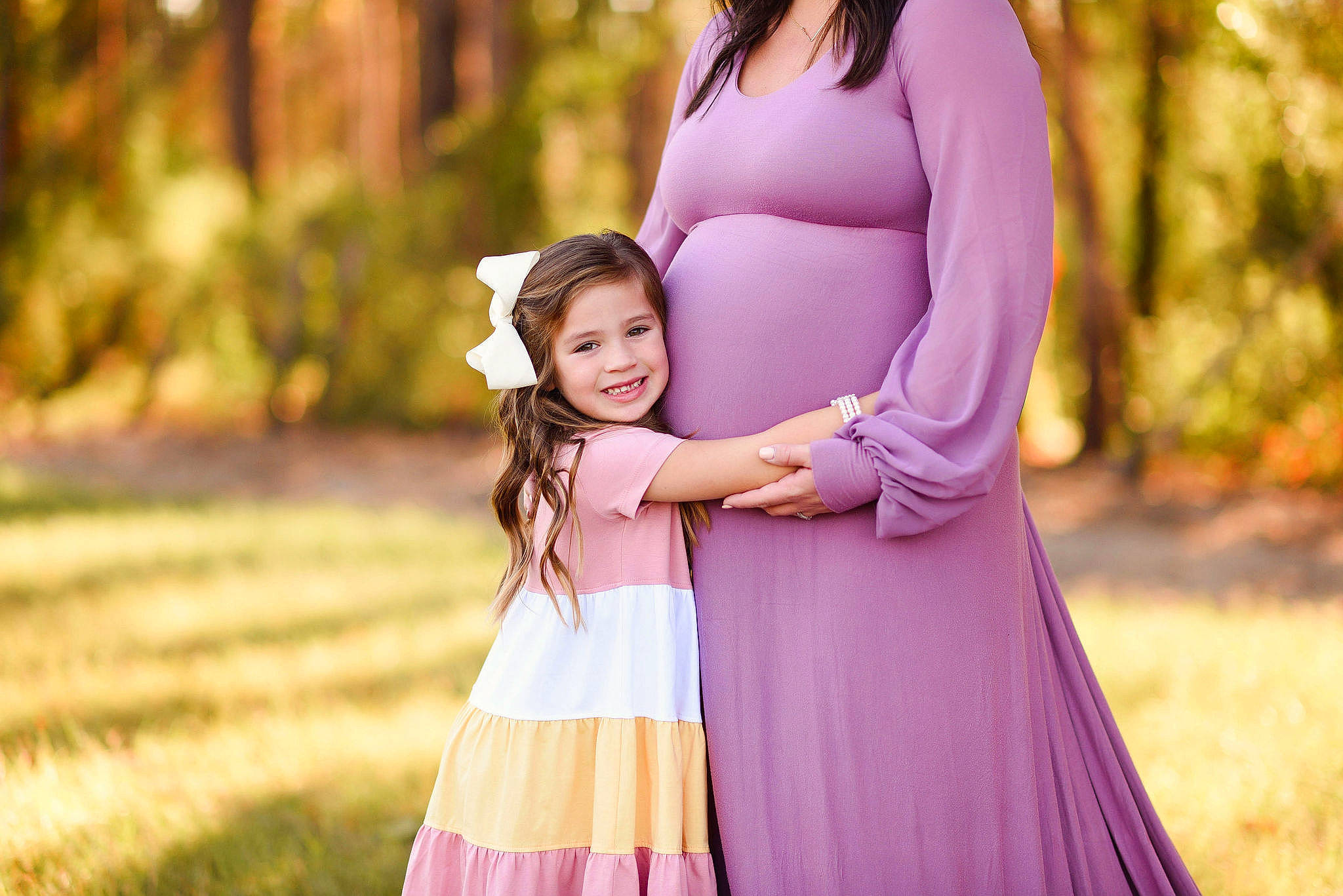 Braelyn is registered to the contest to win money with this photo: child, dress, event, flash_photography, formal_wear, fun, gesture, grass, happy, joy, leisure, long_hair, magenta, outerwear, people_in_nature, person, plant, smile, summer, sunlight