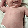 Salem is registered to the contest to win money with this photo: arm, baby, blanket, child, chubby, cute, diaper, expression, face, happy, human, indoors, infant, lying_down, newborn, portrait, relaxed, skin, smile, young