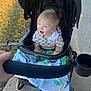 River joined the competition — help win amazing prizes! toddler, child, stroller, blanket, outdoor, sidewalk, grass, happy, smiling, light_hair, clothing, hand, cup_holder, dinosaur_pattern, black_stroller, casual, daylight, person, baby, portrait
