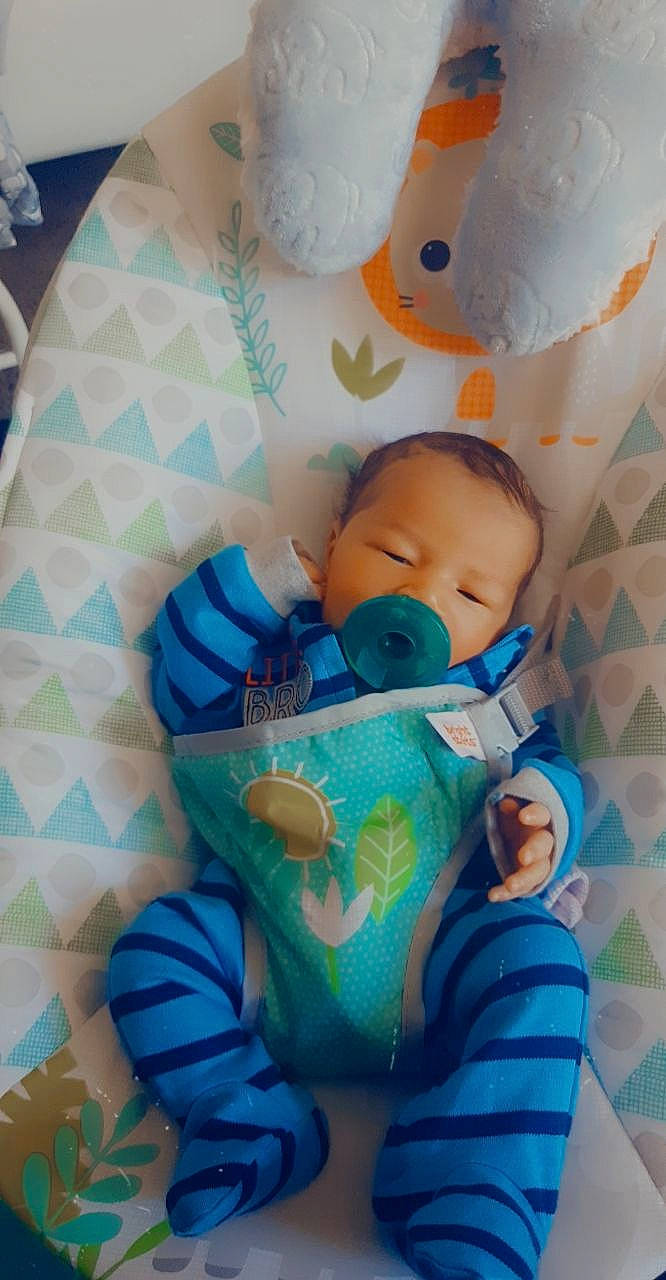 Halo joined the competition — help win amazing prizes! aqua, azure, baby, baby_products, baby_sleeping, baby_toddler_clothing, cheek, child, comfort, drinkware, head, linens, pattern, person, plastic, room, sitting, skin, sleeve, textile