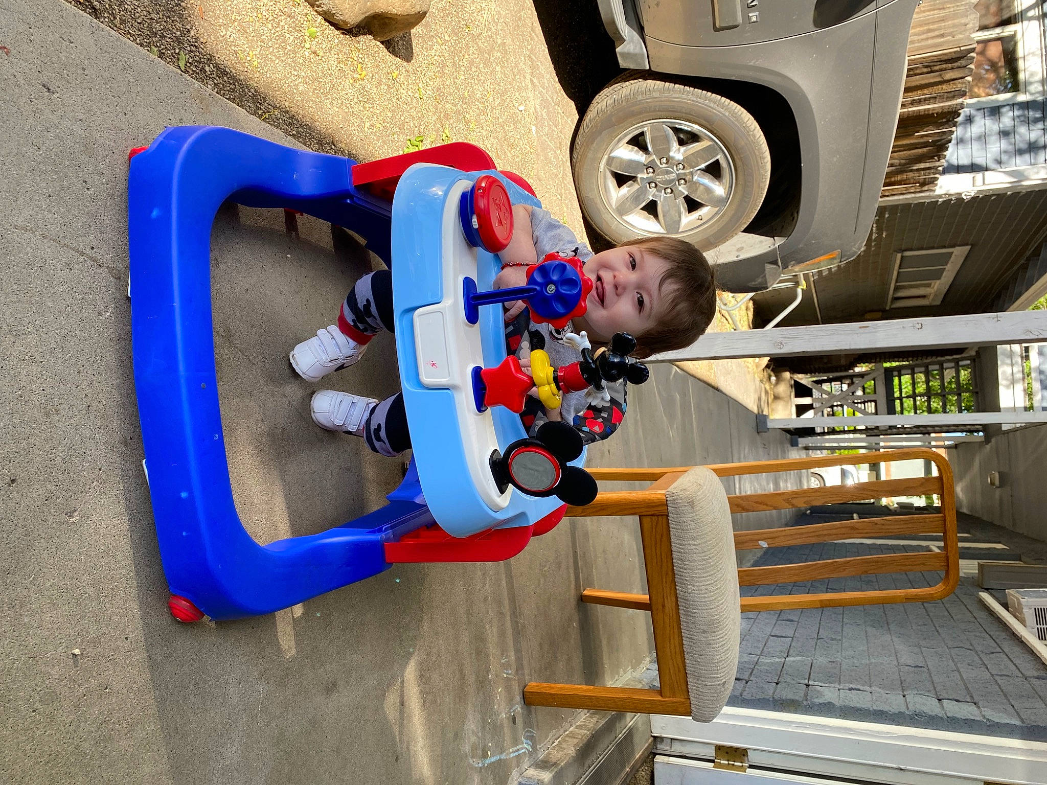 Benjamin is registered to the contest to win money with this photo: auto_part, automotive_design, automotive_exterior, automotive_tire, automotive_wheel_system, car, electric_blue, engineering, fender, hubcap, machine, motor_vehicle, person, synthetic_rubber, t_shirt, tire, tire_care, toddler, tread, vehicle