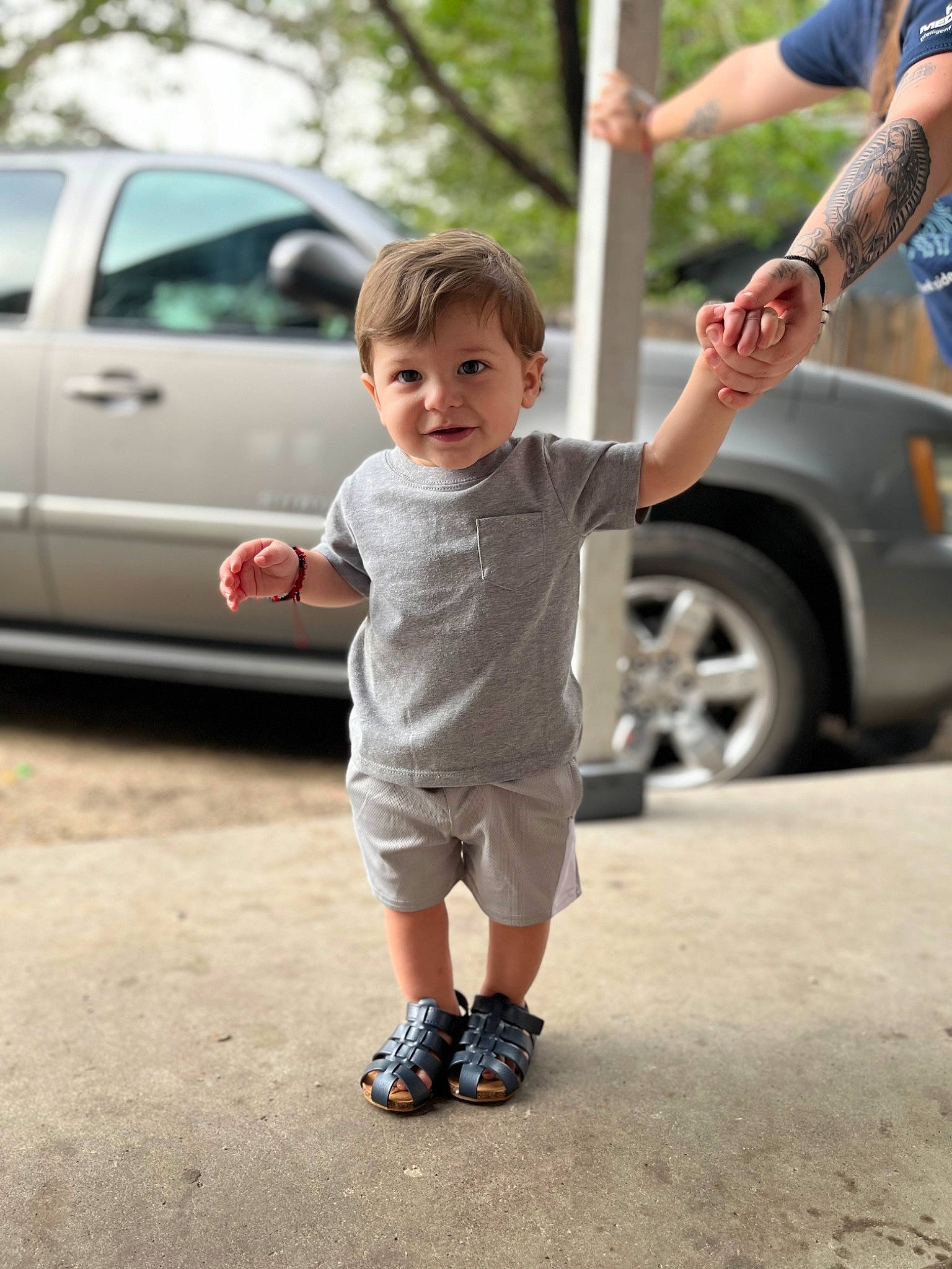 Benjamin joined the competition — help win amazing prizes! asphalt, automotive_design, automotive_exterior, automotive_tire, car, gesture, hand, happy, joy, land_vehicle, leg, motor_vehicle, person, plant, public_space, shorts, standing, tire, tree, vehicle