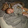 child, dog, sleeping, bed, blanket, pajamas, diaper, pet, friendship, cozy, indoor, rest, nap, animal, human, cute, peaceful, soft, comfort, relax