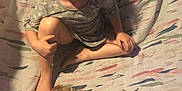 Niomi joined the competition — help win amazing prizes! child, smiling, rabbit, pet, food_bowl, indoor, patterned_sheet, barefoot, long_hair, casual_clothing, sitting, animal, furry, young, happy, cute, playful, home, cozy, friendly