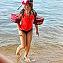 beach, child, floaties, fun, goggles, happy, outdoor, person, playful, sand, shore, splashing, summer, sunny, swimming, swimsuit, vacation, water, wet_hair, young
