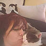 affection, casual, cat, closeup, comfort, couch, cozy, face, feline, hair, home, indoor, kiss, love, person, pet, pillow, portrait, relax, rest