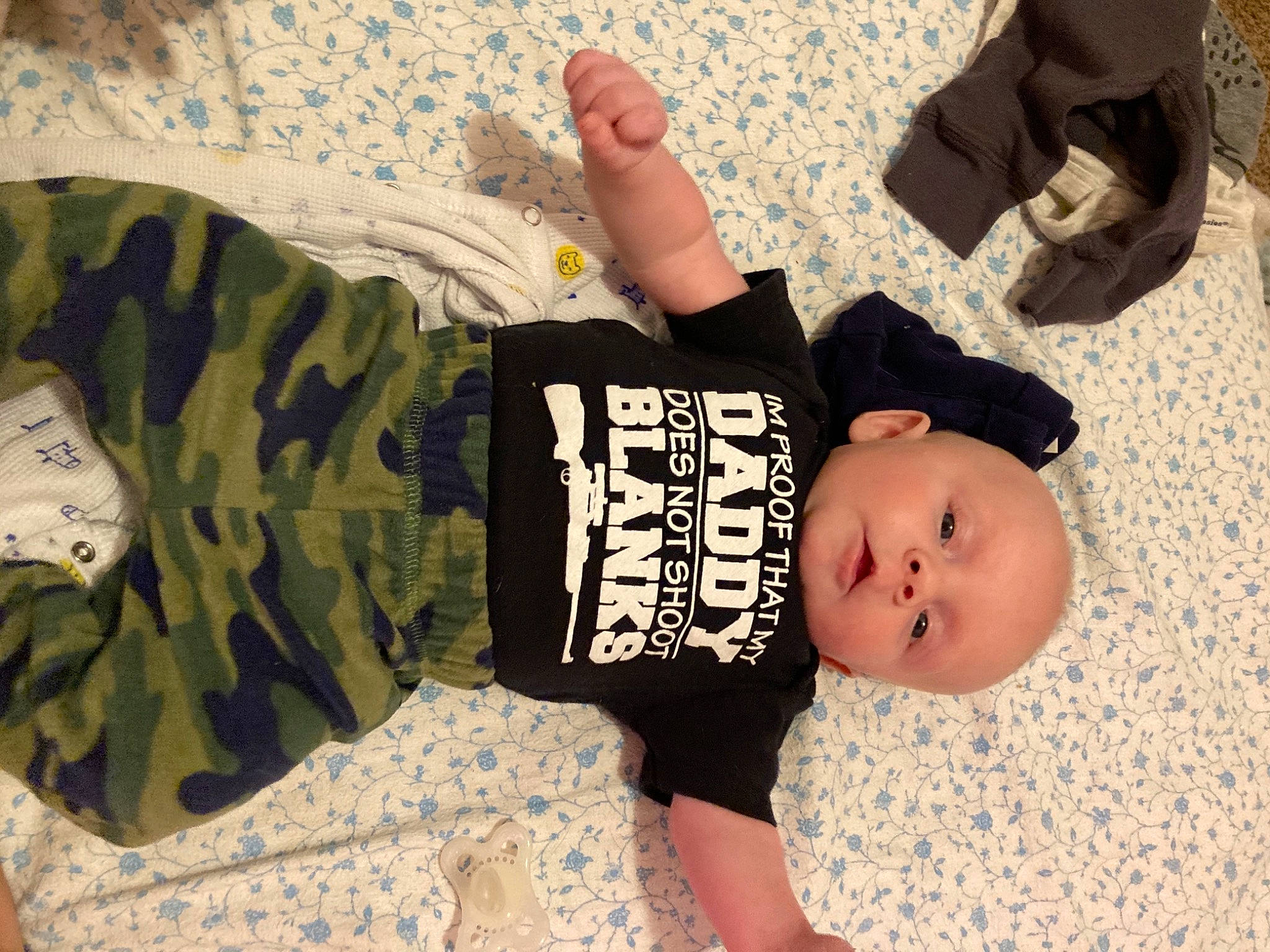 Levi joined the competition — help win amazing prizes! arm, baby_toddler_clothing, camouflage, child, comfort, finger, gesture, hand, head, headgear, human_body, joint, leg, mammal, military_camouflage, person, sleeve, textile, thigh, toddler