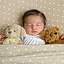 Esmée a rejoint le concours — aidez-le/la à gagner de superbes lots ! baby, sleeping, teddy_bear, plush_toy, blanket, patterned_blanket, cozy, cute, infant, child, soft_toys, bedtime, resting, peaceful, indoor, comfort, adorable, young_child, portrait, cuddly