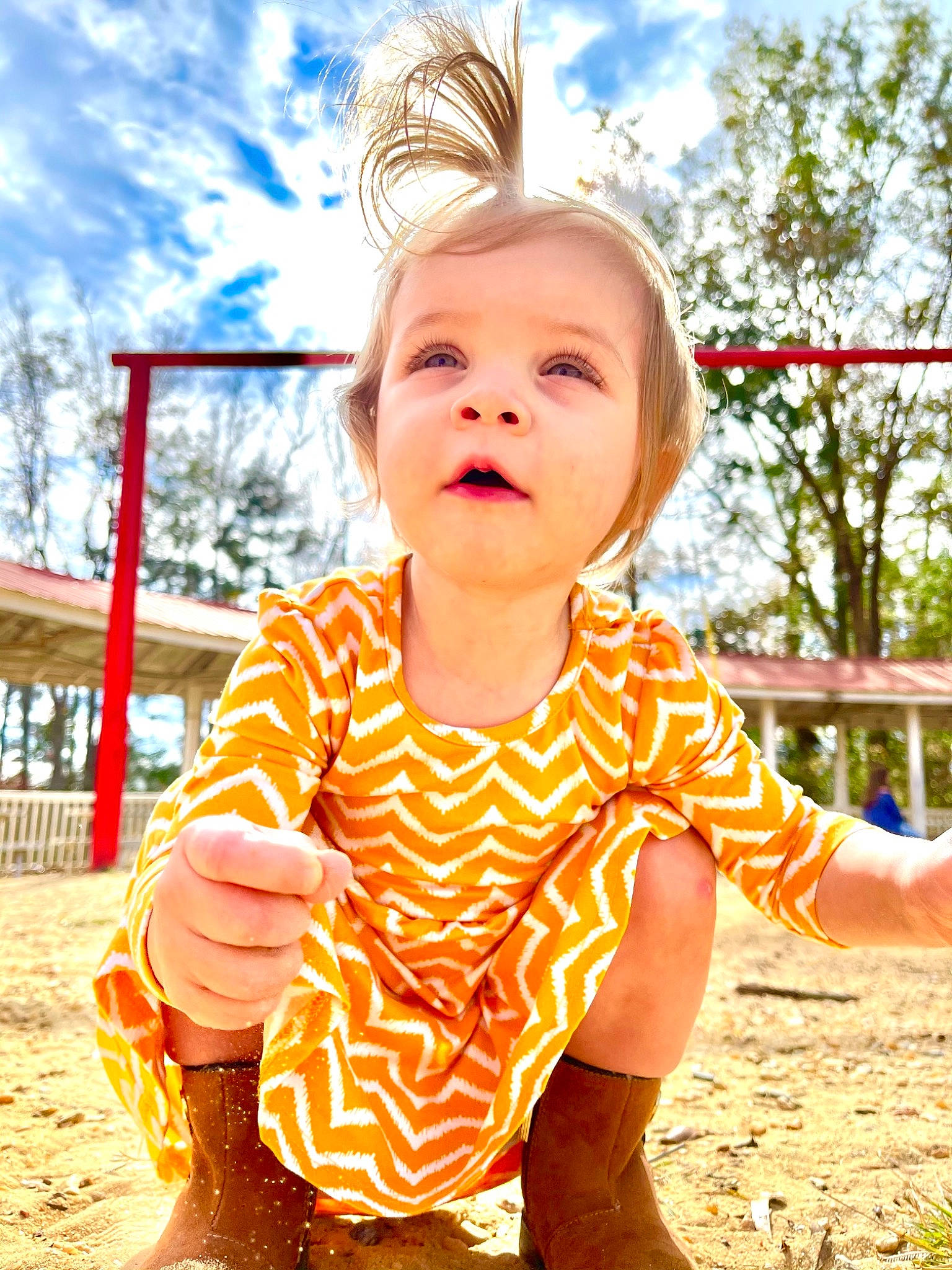 Layla is registered to the contest to win money with this photo: baby_toddler_clothing, child, city, cloud, cool, face, facial_expression, fun, grass, happy, leisure, people_in_nature, person, playground, recreation, sky, sleeve, summer, t_shirt, toddler