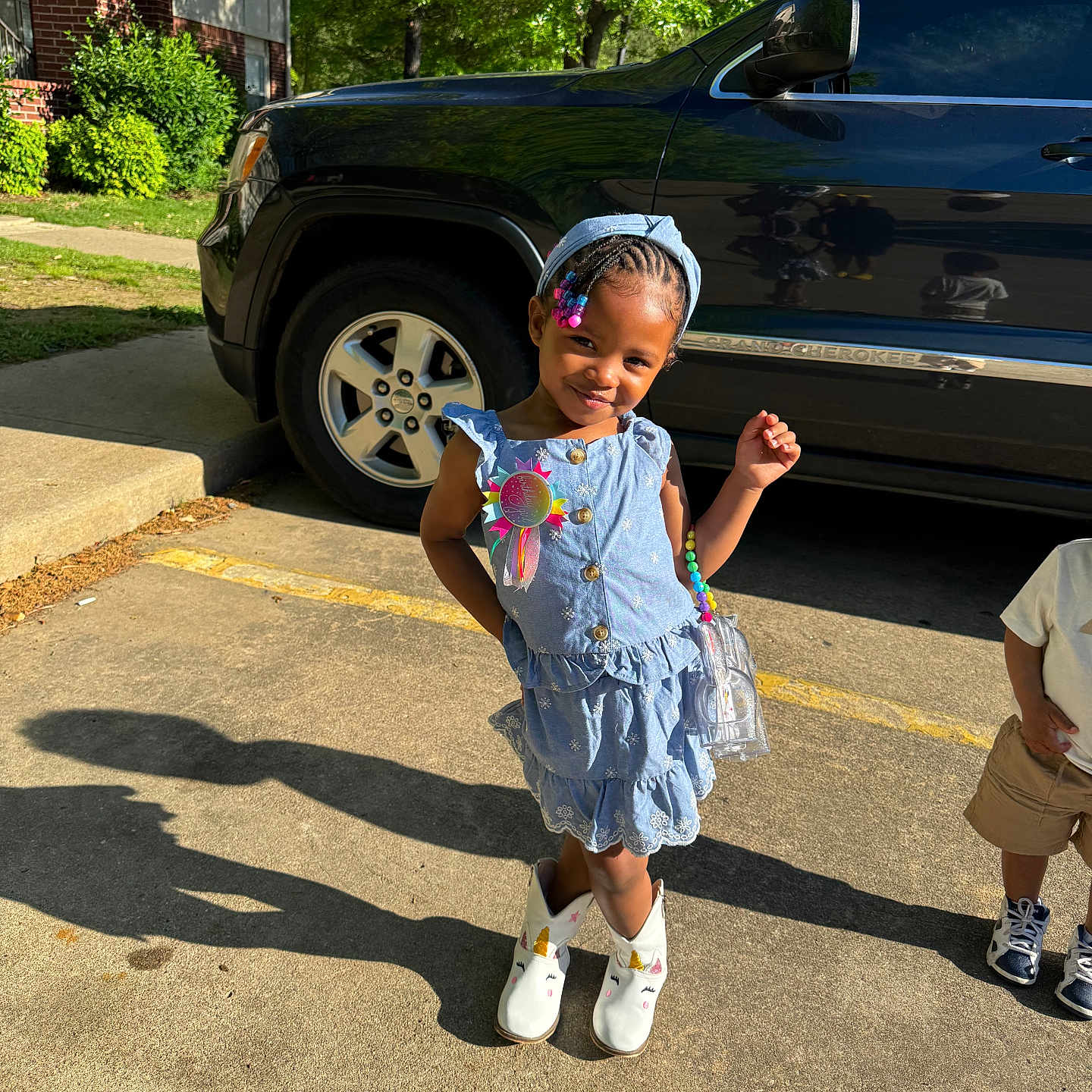 Khari is registered to the contest to win money with this photo: accessories, alloywheel, boy, car, carwheel, child, clothing, female, footwear, girl, machine, male, person, shoe, shorts, spoke, tire, transportation, vehicle, wheel