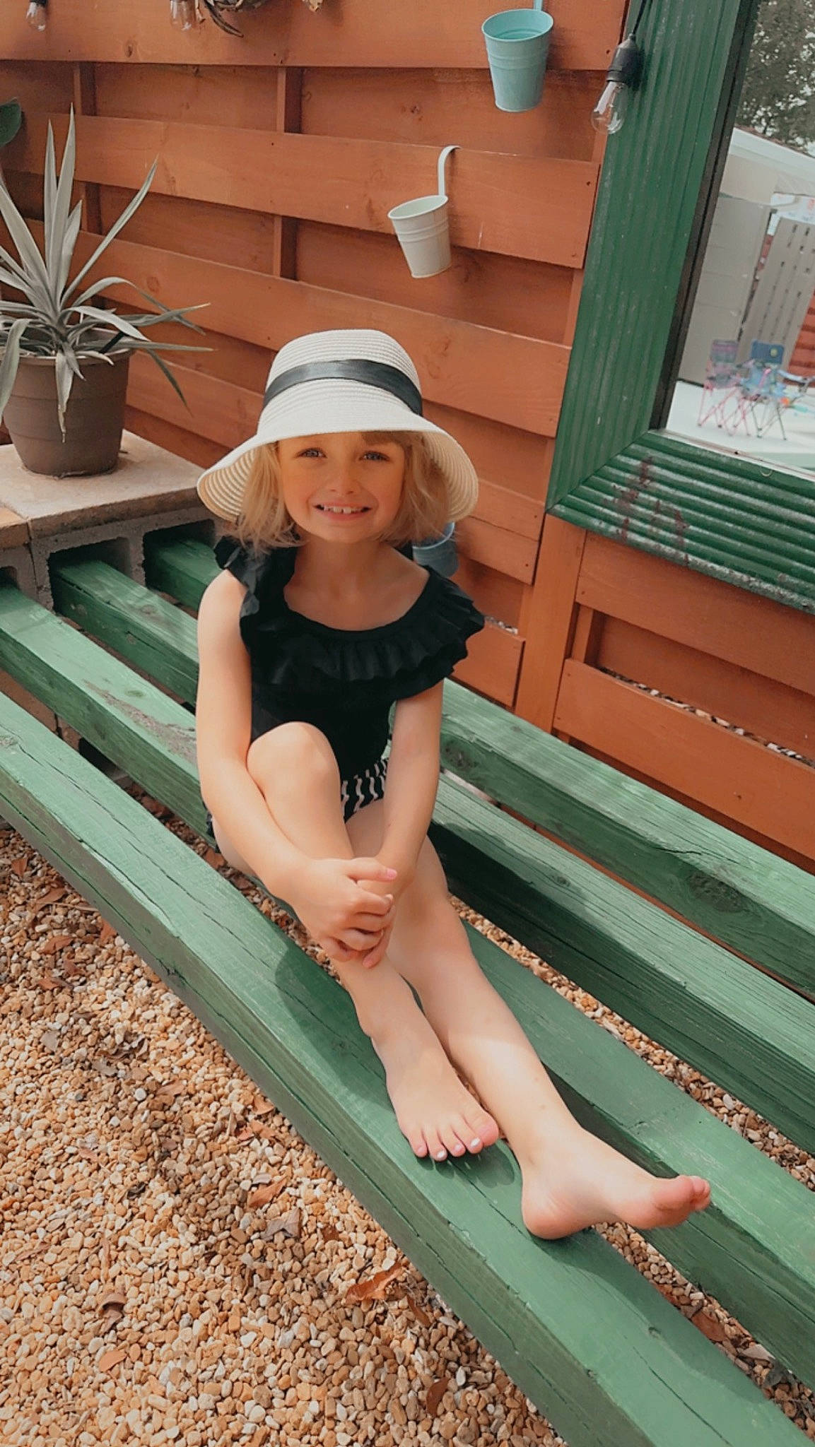 Nala joined the competition — help win amazing prizes! barefoot, cap, flowerpot, foot, fun, grass, green, happy, hat, headwear, houseplant, human_leg, joy, knee, leg, leisure, person, plant, playground_slide, sun_hat