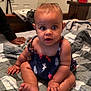Leilanii joined the competition — help win amazing prizes! baby, child, infant, sitting, quilt, bedroom, dress, patterned_clothing, hand, foot, curious_expression, wide_eyes, skin, earrings, indoor, person, furniture, door, blanket, toy