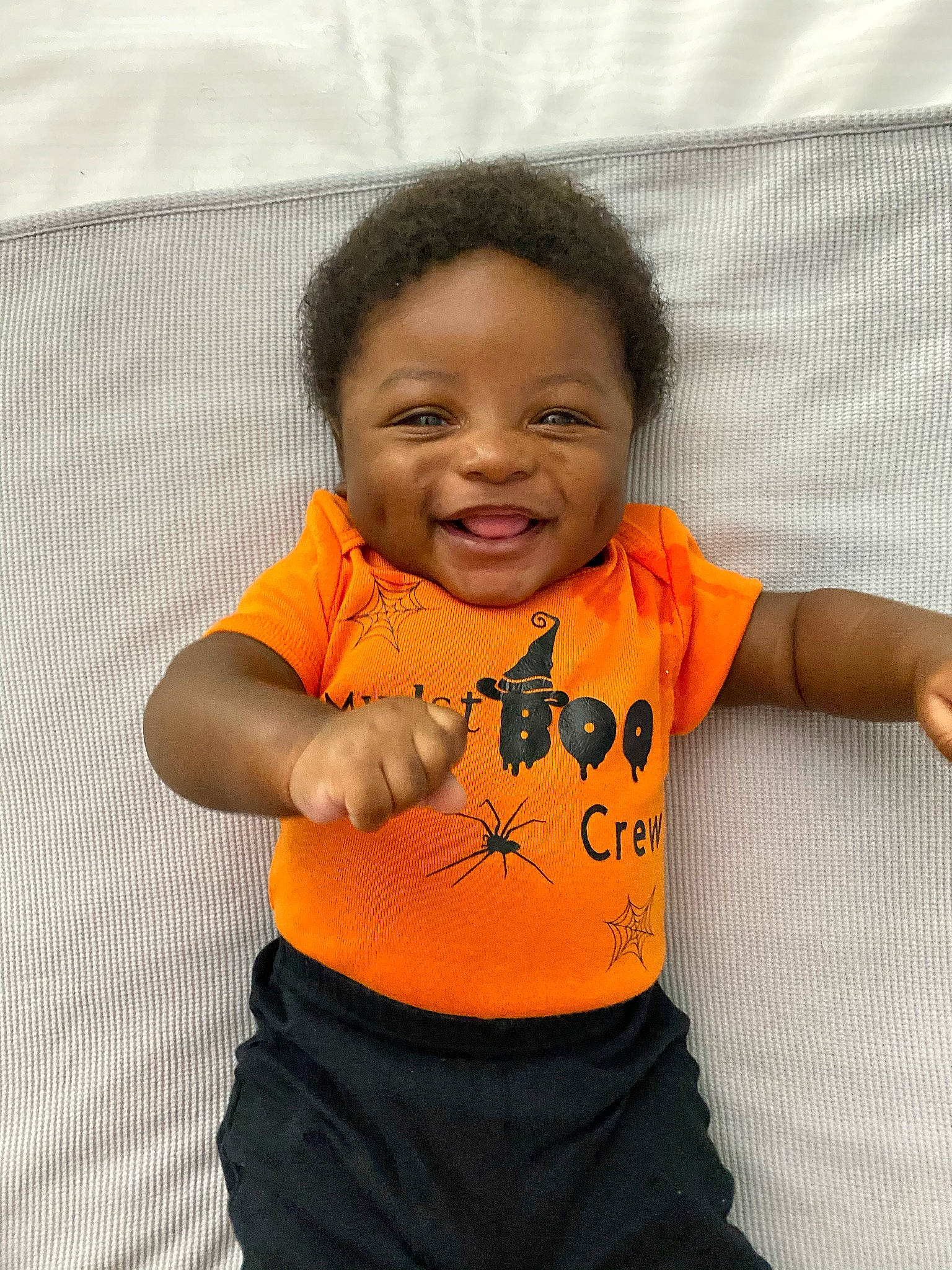 Khamari joined the competition — help win amazing prizes! arm, baby, cheek, child, face, fun, head, orange, person, skin, sleeve, smile, t_shirt, toddler, top