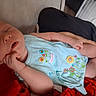 Gracie is registered to the contest to win money with this photo: baby, sleeping, infant, blue_outfit, embroidered_flowers, hand, lap, fan, blanket, indoor, person, skin, peaceful, cute, resting, soft, comfort, child, toddler, cozy