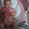 baby, infant, pink, cushion, pacifier, striped_clothing, blanket, leopard_print, seat, happy, smiling, child, indoors, person, comfort, cute, young, face, head, sitting