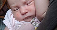 Gracie joined the competition — help win amazing prizes! baby, infant, sleeping, pink_mittens, closeup, face, arm, skin, clothing, person, newborn, rest, cute, indoor, soft_light, expression, human, child, comfort, toddler