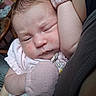 baby, infant, sleeping, pink_mittens, closeup, face, arm, skin, clothing, person, newborn, rest, cute, indoor, soft_light, expression, human, child, comfort, toddler