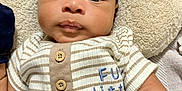 Pablo joined the competition — help win amazing prizes! baby, infant, face, eyes, clothing, striped_shirt, buttons, mittens, pillow, teddy_bear, soft_texture, laying_down, curious_expression, close_up, indoor, child, person, portrait, cute, young