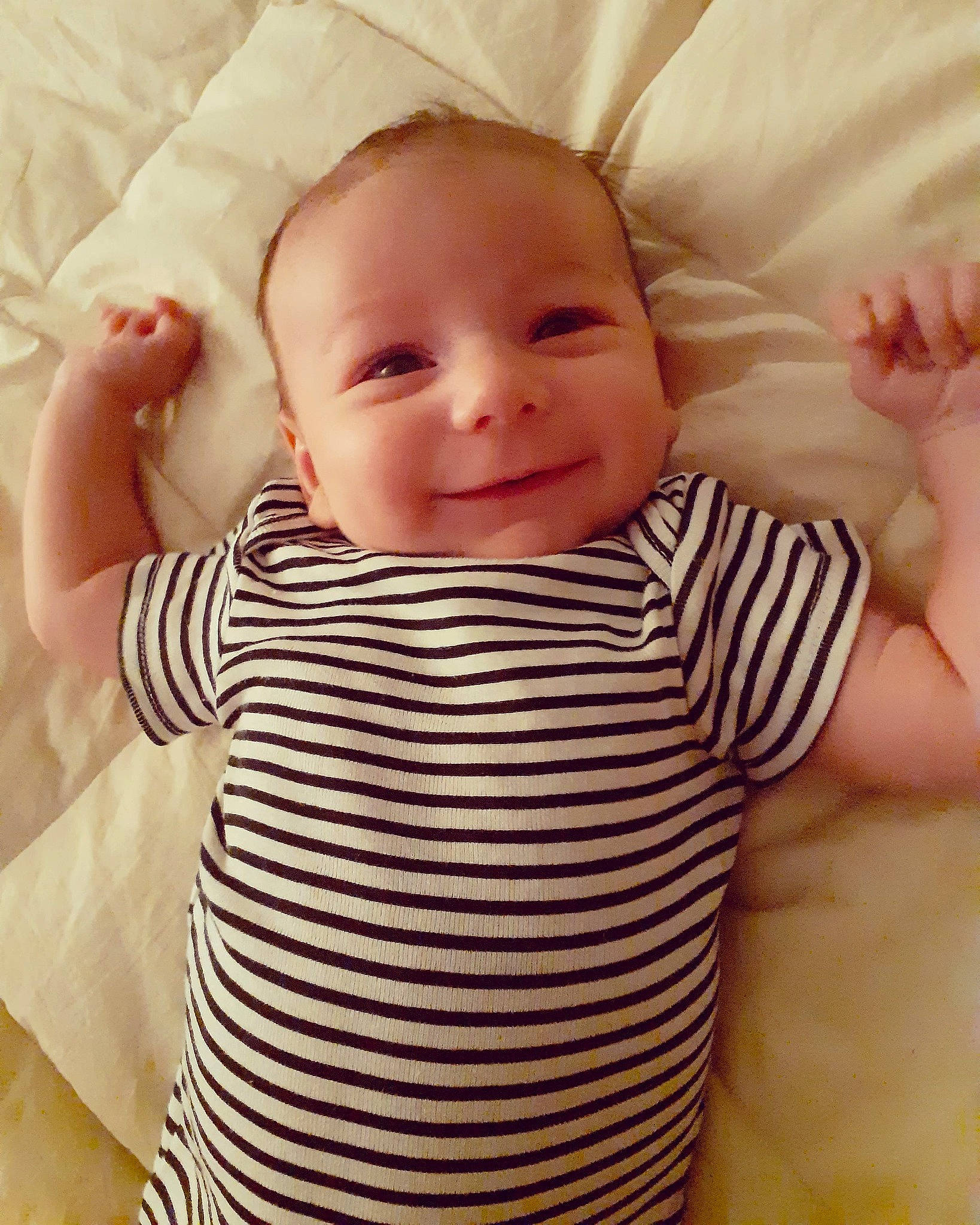 Wyatt is registered to the contest to win money with this photo: baby, baby_toddler_clothing, cheek, chin, comfort, eye, eyebrow, face, finger, gesture, happy, iris, joy, lip, person, pink, product, skin, sleeve, smile