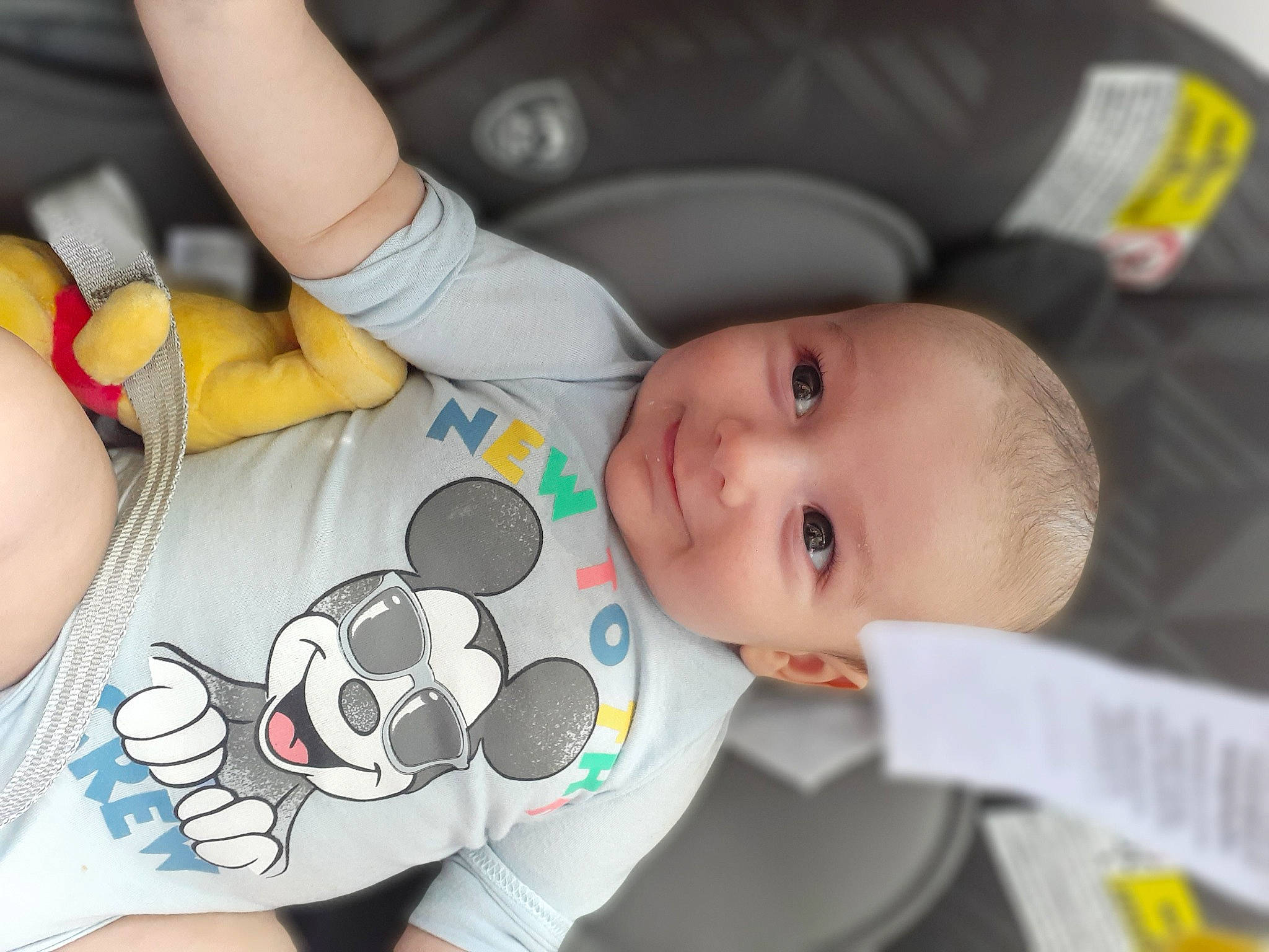 Wyatt is registered to the contest to win money with this photo: baby, baby_products, baby_toddler_clothing, black, car_seat, cheek, child, comfort, drinkware, eye, finger, joy, mouth, nail, organ, person, photograph, product, skin, smile