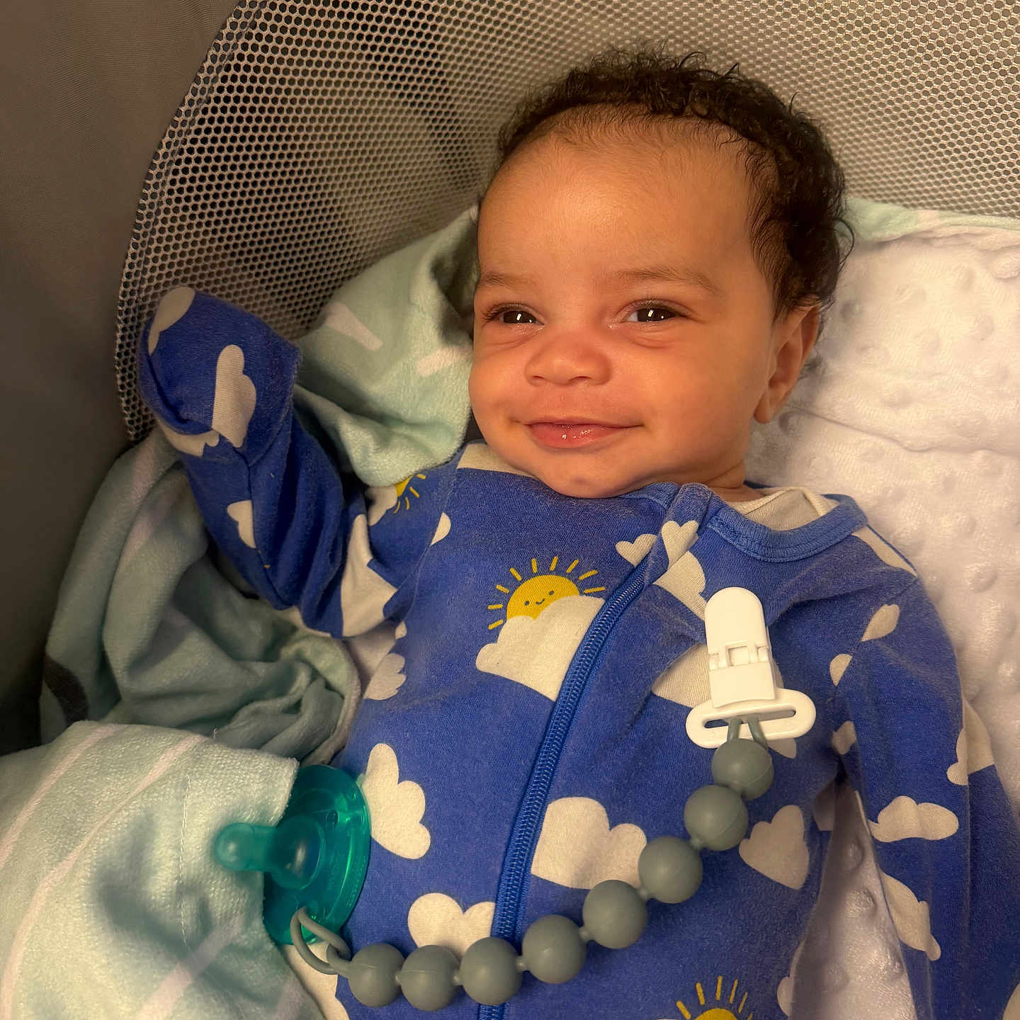 Ayden joined the competition — help win amazing prizes! baby, infant, smile, pajamas, blue, clouds, sun, crib, blanket, pacifier, clip, beads, sleepwear, cute, child, portrait, indoors, resting, happy, newborn