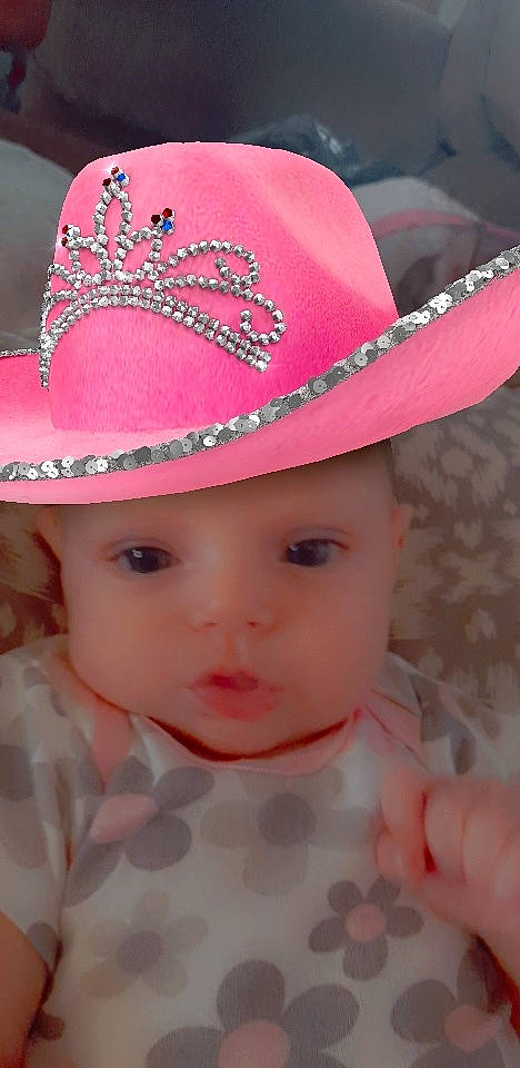 Naomi is registered to the contest to win money with this photo: art, baby_toddler_clothing, cap, child, chin, costume_hat, creative_arts, eyebrow, eyelash, fedora, hat, headgear, headwear, lip, magenta, pattern, person, pink, skin, sun_hat