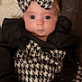 Delylah Rose joined the competition — help win amazing prizes! baby, black_and_white, blanket, bow, child, clothing, cozy, cute, expression, face, fashion, headband, houndstooth, indoors, infant, newborn, person, portrait, soft_toys, wide_eyes