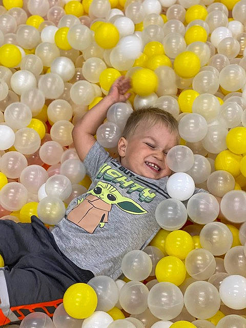 Emin is registered to the contest to win money with this photo: ball_pit, balloon, beauty, black, child, event, facial_expression, fun, happy, joy, leisure, party_supply, pattern, person, photograph, play, product, smile, snapshot, toddler