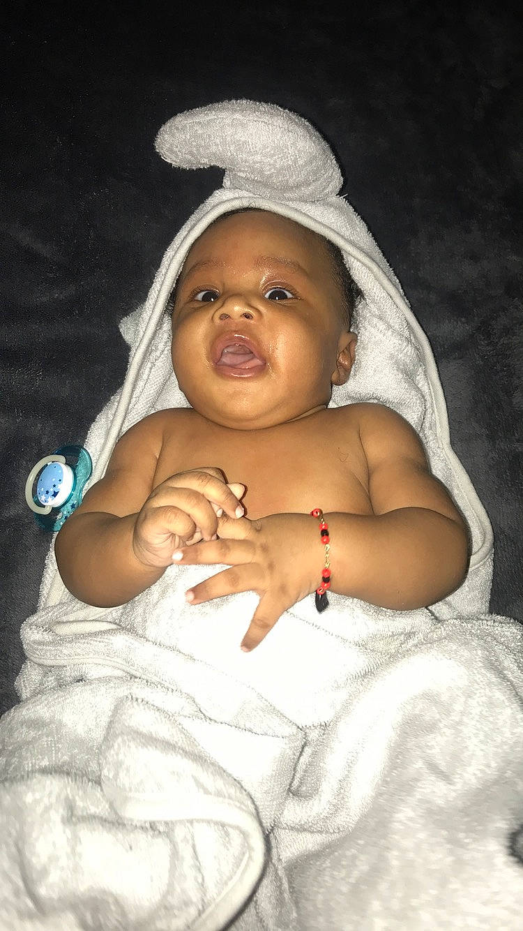 Lamar is registered to the contest to win money with this photo: baby, child, headwear, person, photography, skin, smile, toddler