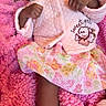 Annaliese joined the competition — help win amazing prizes! baby, pacifier, pink_blanket, pink_jacket, floral_skirt, infant, child, cute, sleepwear, cozy, soft_texture, newborn, hands, feet, warm_clothing, indoor, resting, portrait, person, sitting