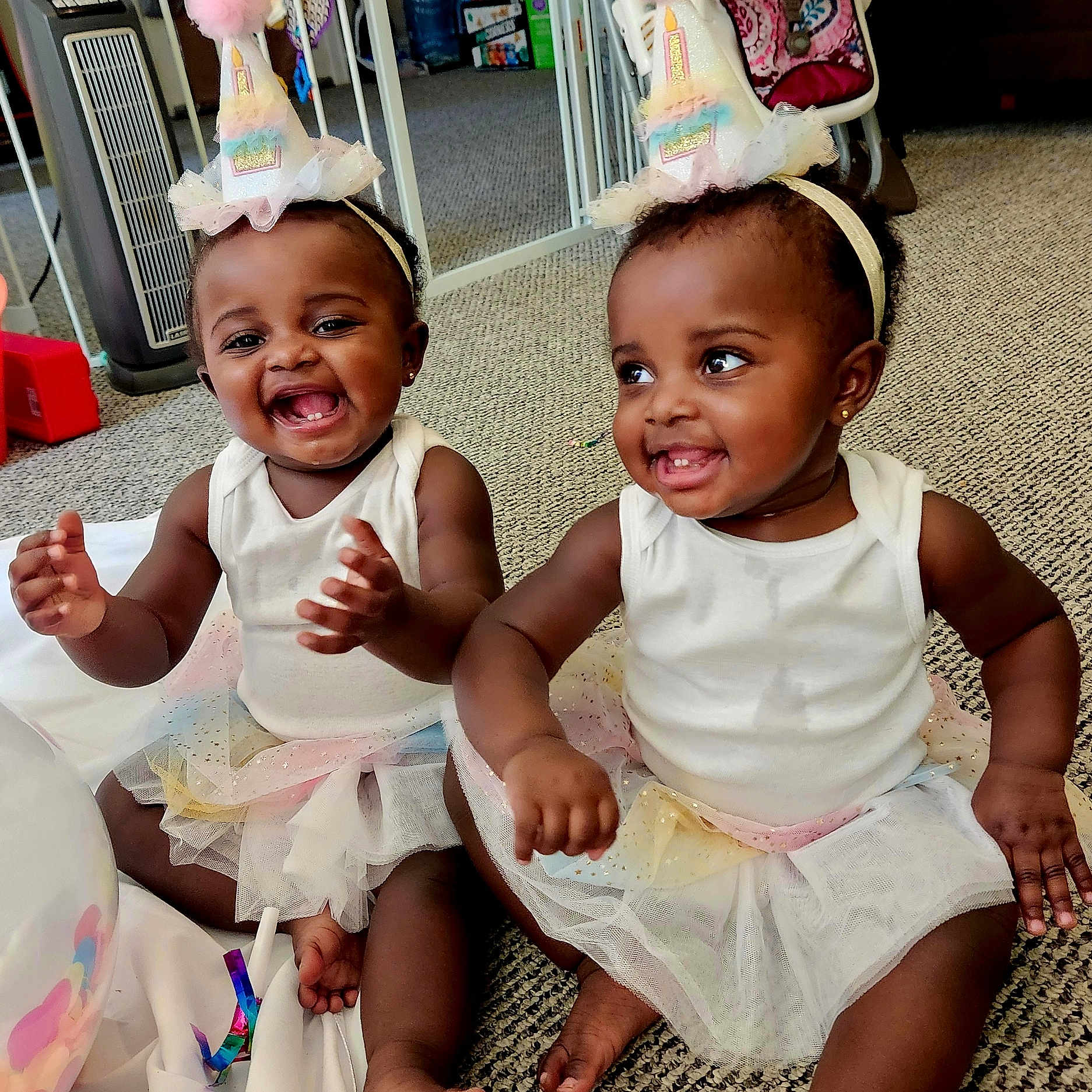 Lark And Lotus joined the competition — help win amazing prizes! baby, carpet, celebration, child, clothing, cute, footwear_barefoot, fun, happy, headband, indoor, person, playful, sitting, smiling, toddler, tutu, two_children, unicorn_headband, white_tank_top